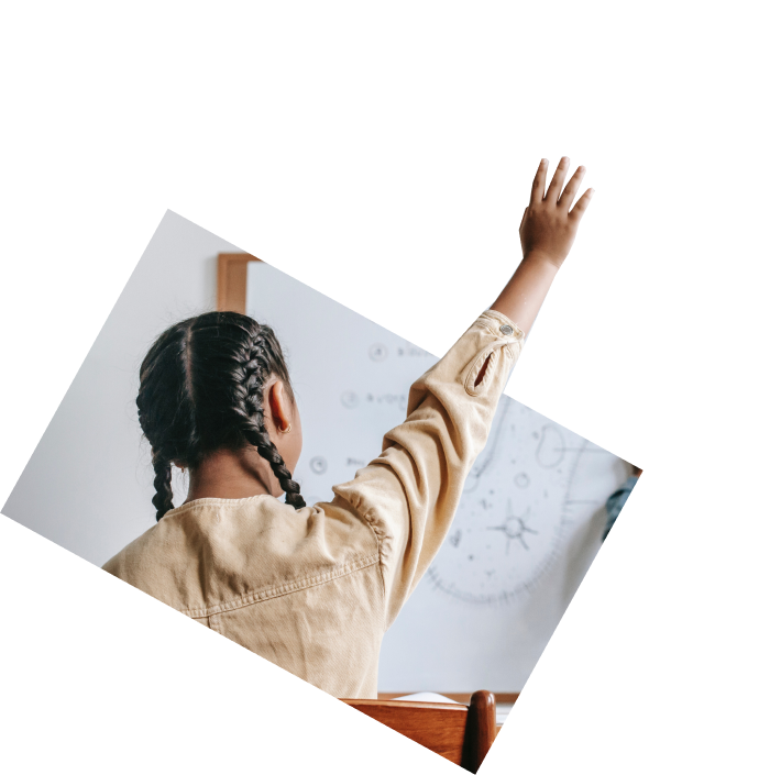 student with braids at a dry-erase board